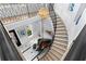 Grand foyer featuring a winding staircase, piano, and elegant chandelier at 419 S Shore Crest Dr, Tampa, FL 33609