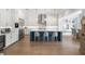 Spacious kitchen with stainless steel appliances, custom cabinets, a large center island, and hardwood flooring at 419 S Shore Crest Dr, Tampa, FL 33609