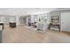 Large living room with hardwood floors, neutral walls, and a bar with seating at 419 S Shore Crest Dr, Tampa, FL 33609