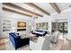 Stylish living room features beamed ceilings, fireplace, art, comfortable seating, and an open floor plan at 419 S Shore Crest Dr, Tampa, FL 33609