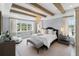 Spacious main bedroom with wood beams, chandelier, and large windows at 419 S Shore Crest Dr, Tampa, FL 33609