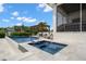 Inviting pool and spa area with pergola, lounge chairs and serene views at 419 S Shore Crest Dr, Tampa, FL 33609
