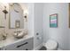 Chic powder room featuring marble countertop, a unique vessel sink, modern fixtures, and tasteful decor at 419 S Shore Crest Dr, Tampa, FL 33609