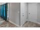 Neutral-toned hallway with natural wood flooring and white doors at 4238 Glissade Dr, New Port Richey, FL 34652
