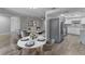 Spacious living and dining area featuring modern kitchen appliances and neutral decor at 4238 Glissade Dr, New Port Richey, FL 34652