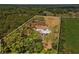 Aerial view highlighting property boundaries and the surrounding lush landscape, including home at 495 Appaloosa Rd, Tarpon Springs, FL 34688