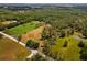 Aerial view showcasing expansive land, lush trees, and a serene residential area at 495 Appaloosa Rd, Tarpon Springs, FL 34688