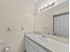 Bathroom with a well-lit vanity and a large mirror over the sink and a shower/tub combo at 495 Appaloosa Rd, Tarpon Springs, FL 34688