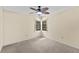 Cozy bedroom featuring neutral tones, a ceiling fan, and a window with natural light at 495 Appaloosa Rd, Tarpon Springs, FL 34688