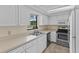 Bright kitchen with stainless steel appliances, ample counter space, and a window offering outside views at 495 Appaloosa Rd, Tarpon Springs, FL 34688
