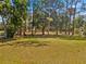 Expansive lot with mature trees, partially fenced, offering both open space and privacy at 495 Appaloosa Rd, Tarpon Springs, FL 34688