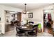 Cozy dining area with a wooden table and chairs, flowing into other living spaces at 504 Casas Bonitas Dr, Nokomis, FL 34275