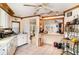 Spacious kitchen with tile flooring, white cabinets, and an open design blending functionality with charm at 504 Casas Bonitas Dr, Nokomis, FL 34275