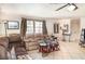 Spacious living room featuring tile flooring and abundant natural light at 504 Casas Bonitas Dr, Nokomis, FL 34275