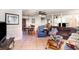 Expansive living area with tile floors, sofa, dining table, and a large mirror at 504 Casas Bonitas Dr, Nokomis, FL 34275