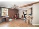 Open living area with wood flooring and a breakfast bar seamlessly connecting spaces at 504 Casas Bonitas Dr, Nokomis, FL 34275