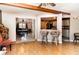 Open-concept living space with tile and wood flooring connecting dining and kitchen areas for easy entertaining at 504 Casas Bonitas Dr, Nokomis, FL 34275