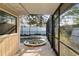 Screened in pool area featuring an in-ground pool, spa, and view of the backyard beyond at 504 Casas Bonitas Dr, Nokomis, FL 34275