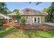 Charming home features a spacious wooden deck, perfect for outdoor entertaining and relaxation at 5707 N Branch Ave, Tampa, FL 33604