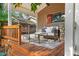Relaxing covered deck boasts comfortable seating, perfect for enjoying the outdoors at 5707 N Branch Ave, Tampa, FL 33604