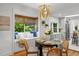 Charming dining area with a built-in window seat and stylish chandelier near the kitchen at 5707 N Branch Ave, Tampa, FL 33604