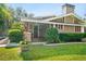 Charming craftsman home featuring a well-manicured lawn and welcoming front porch at 5707 N Branch Ave, Tampa, FL 33604