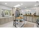 Bright and modern kitchen featuring stainless steel appliances, a skylight, and ample counter space at 5707 N Branch Ave, Tampa, FL 33604
