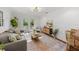 Inviting living room with a comfortable sofa and French doors leading to the backyard at 5707 N Branch Ave, Tampa, FL 33604