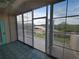 Enclosed balcony with tile flooring offering serene views of the outdoors at 6315 Shoreline Dr # 3107, St Petersburg, FL 33708