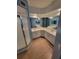 This bathroom features double sinks, white cabinetry, ample counter space and a tiled shower at 6315 Shoreline Dr # 3107, St Petersburg, FL 33708