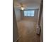 Bedroom showcasing tile flooring, natural lighting, and a ceiling fan at 6315 Shoreline Dr # 3107, St Petersburg, FL 33708
