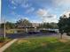 Scenic view of a community pond with a fountain, surrounded by trees and landscaping at 6315 Shoreline Dr # 3107, St Petersburg, FL 33708