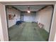 An empty garage with a concrete floor, shelving, and some stored items at 6315 Shoreline Dr # 3107, St Petersburg, FL 33708