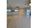 Large open-concept living space featuring tile flooring, ceiling fan, and view to kitchen at 6315 Shoreline Dr # 3107, St Petersburg, FL 33708