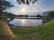 Scenic view of a serene pond reflecting the sky and surrounding greenery at 6315 Shoreline Dr # 3107, St Petersburg, FL 33708