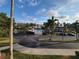Scenic view of a community pool with a fountain, surrounded by trees and landscaping at 6315 Shoreline Dr # 3107, St Petersburg, FL 33708