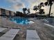 Community pool with comfortable lounge chairs and inviting deck area at 6315 Shoreline Dr # 3107, St Petersburg, FL 33708