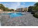 Beautiful community pool area with ample seating and clear blue water at 6315 Shoreline Dr # 3107, St Petersburg, FL 33708