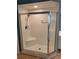 A beautifully tiled shower features glass doors, bench seating, and a modern showerhead at 6315 Shoreline Dr # 3107, St Petersburg, FL 33708