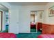 Shared bedroom featuring twin beds, closet, and wood paneled accent wall at 6421 Wilshire Dr, Tampa, FL 33615