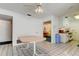 Eat-in kitchen boasts tile flooring and a ceiling fan above the quaint table at 6421 Wilshire Dr, Tampa, FL 33615