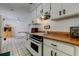 Functional kitchen with ample cabinets and a seamless flow to the dining area at 6421 Wilshire Dr, Tampa, FL 33615