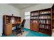 Office space offering a desk with great natural light and a full bookshelf at 6421 Wilshire Dr, Tampa, FL 33615