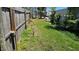 Fenced backyard with tall green grass at 6903 11Th Ave E, Palmetto, FL 34221
