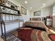 Cozy bedroom with patterned bedding, a microwave and mini-fridge for added convenience at 6903 11Th Ave E, Palmetto, FL 34221