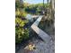 Wooden dock, with a walkway extending into a waterway surrounded by lush greenery at 6903 11Th Ave E, Palmetto, FL 34221