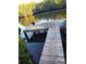 A wooden dock on the water, surrounded by mangroves and a peaceful waterway at 6903 11Th Ave E, Palmetto, FL 34221