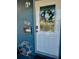 Quirky and inviting front door with a decorative wreath and playful signage at 6903 11Th Ave E, Palmetto, FL 34221