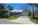 Charming single Gathering home featuring a well manicured lawn and a white metal roof at 6903 11Th Ave E, Palmetto, FL 34221