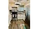 Bright kitchen features stainless steel appliances, granite countertops, and white cabinetry at 6903 11Th Ave E, Palmetto, FL 34221